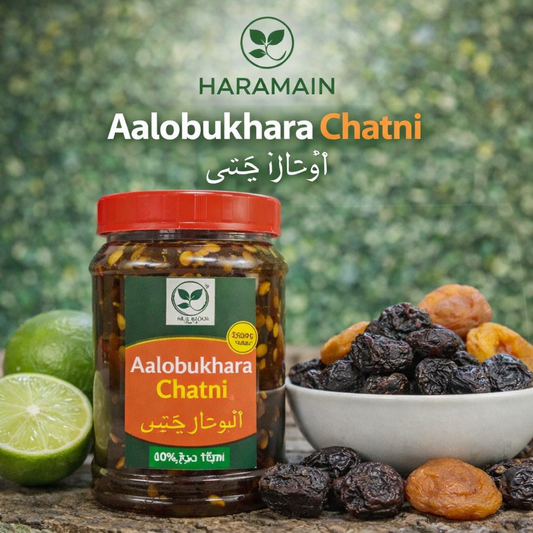 Jar of Aalobukhara Chatni with dried fruits and limes on a green background, featuring the Haramain brand.