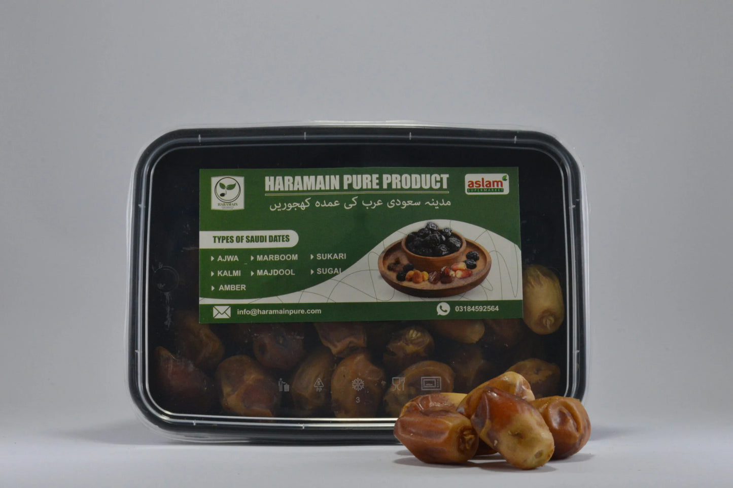 Packaged dates with a Haramain Pure Product label on a gray background