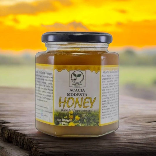Jar of Acacia Modesta Honey with a sunset background