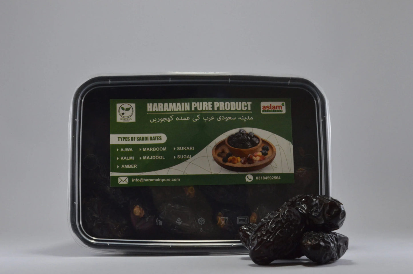 Black container with green label featuring 'Haramain Pure Product' on a gray background