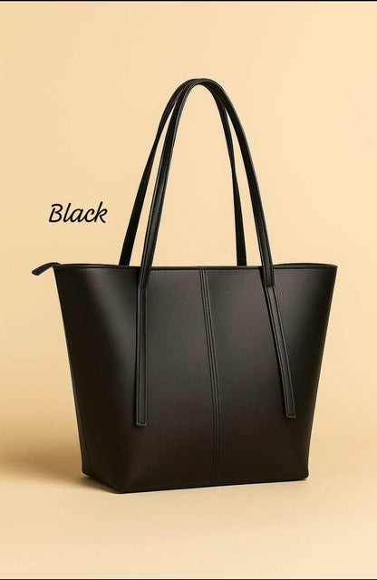 Black tote bag on a beige background