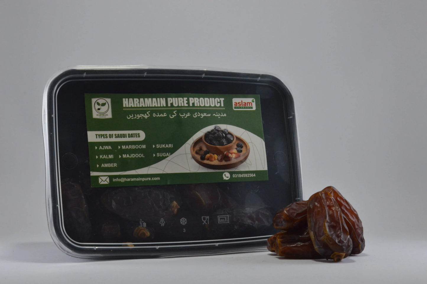 Haramain Pure Product packaging with dates on a gray background