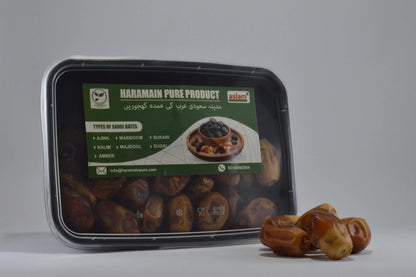 Packaged Haramain Pure Product with dates on a gray background