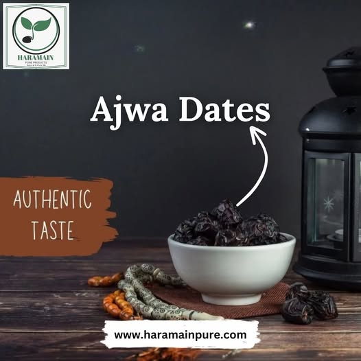 Bowl of Ajwa Dates with a lantern and prayer beads on a dark background, featuring Haramain Pure's branding.
