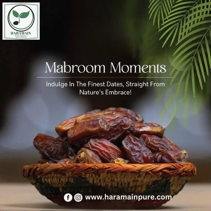 Dried dates in a woven bowl with palm leaves, promoting 'Mabroom Moments' from Haramain Pure.