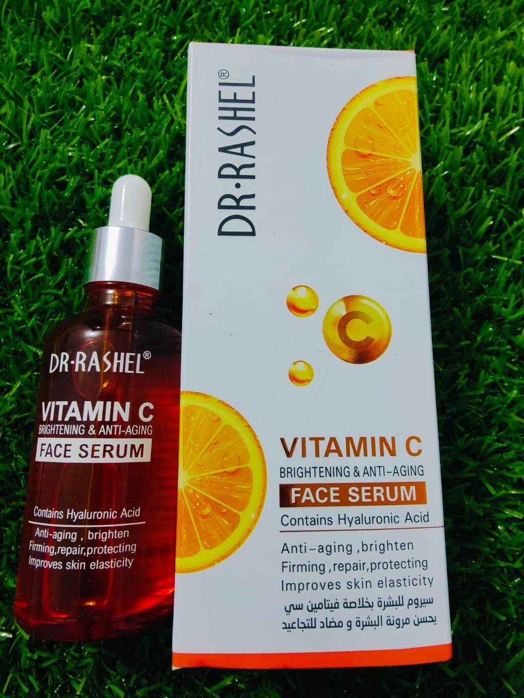 Dr. Rashel Vitamin C face serum bottle and packaging on grass
