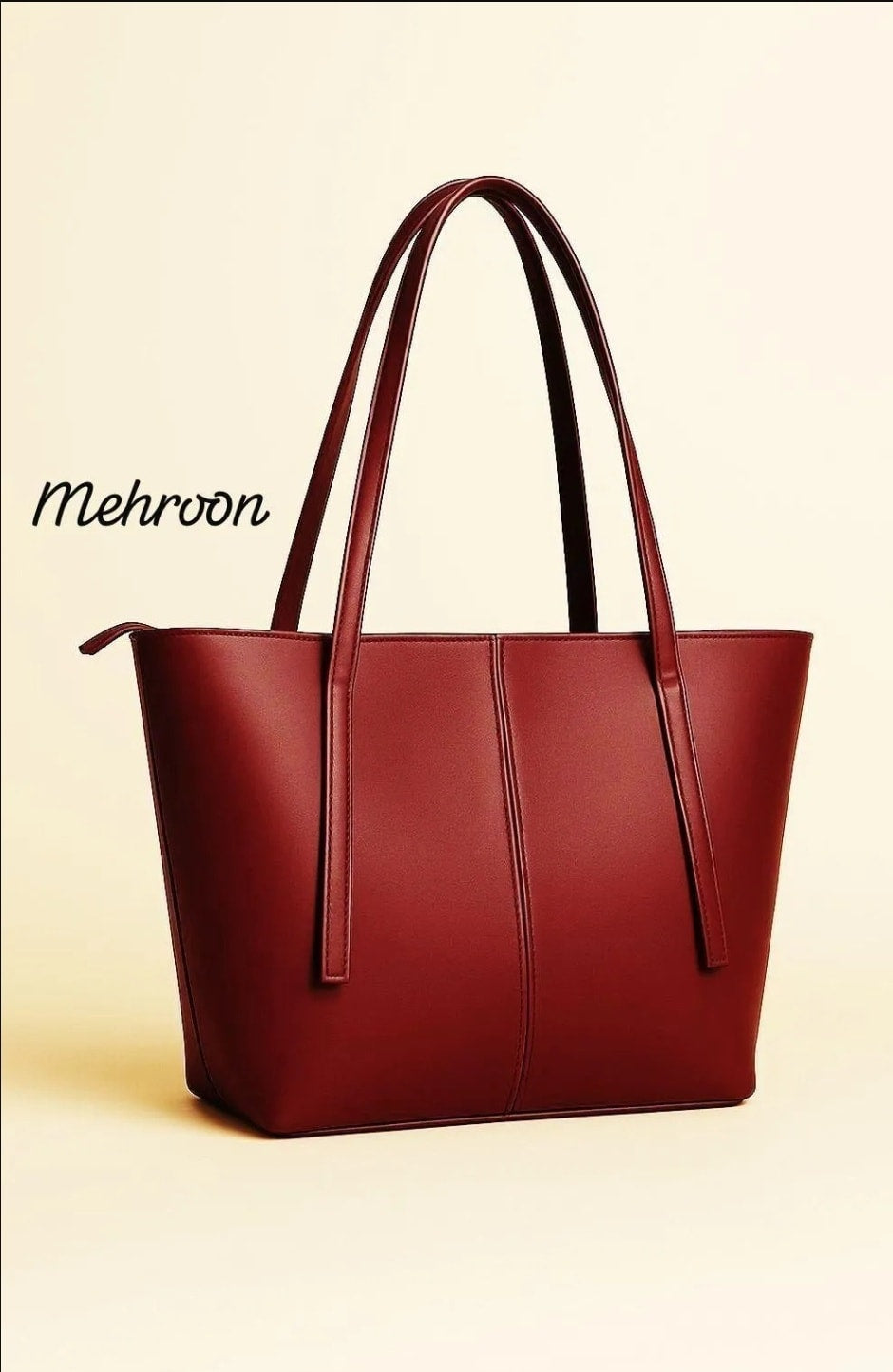 Red handbag with 'Mehroon' branding on a beige background