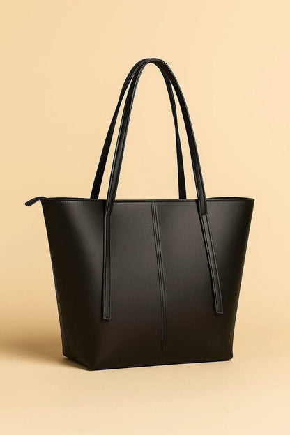 Black tote bag on a beige background