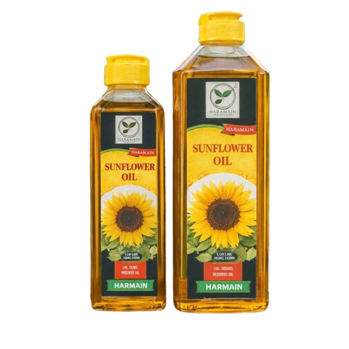 Two bottles of Harmain Sunflower Oil with yellow caps on a white background