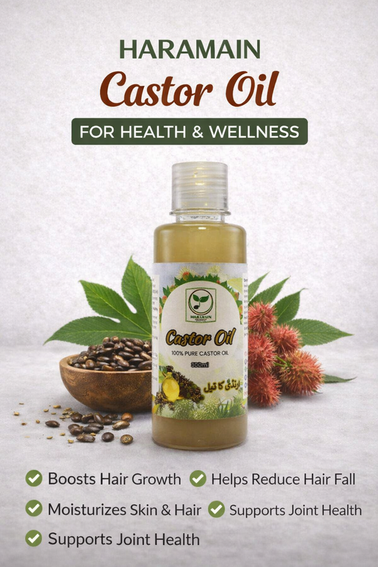 Haramain Castor Oil bottle with castor beans and seeds on a light background