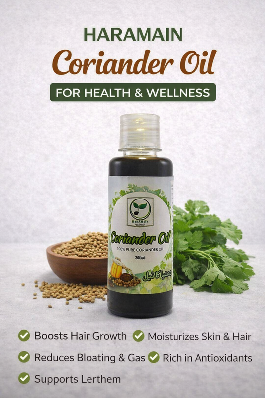 Bottle of Haramain Coriander Oil with coriander seeds and leaves on a light background