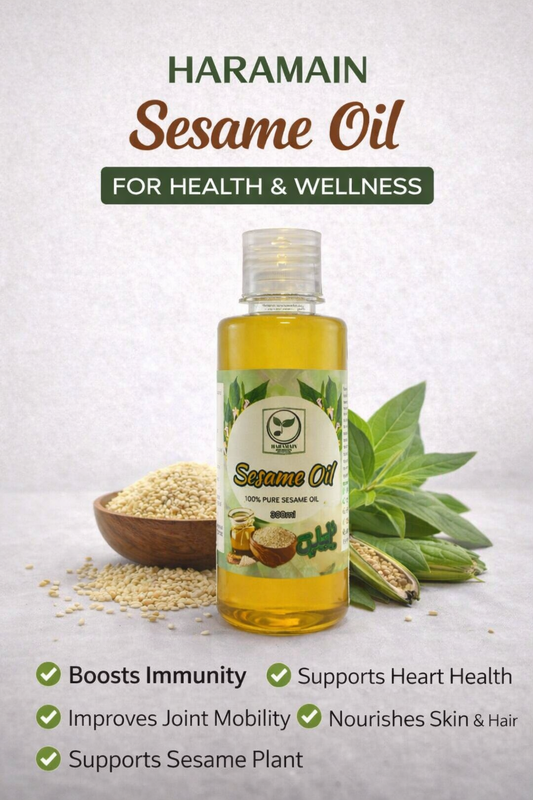 Bottle of Haramain Sesame Oil with sesame seeds and leaves on a light background