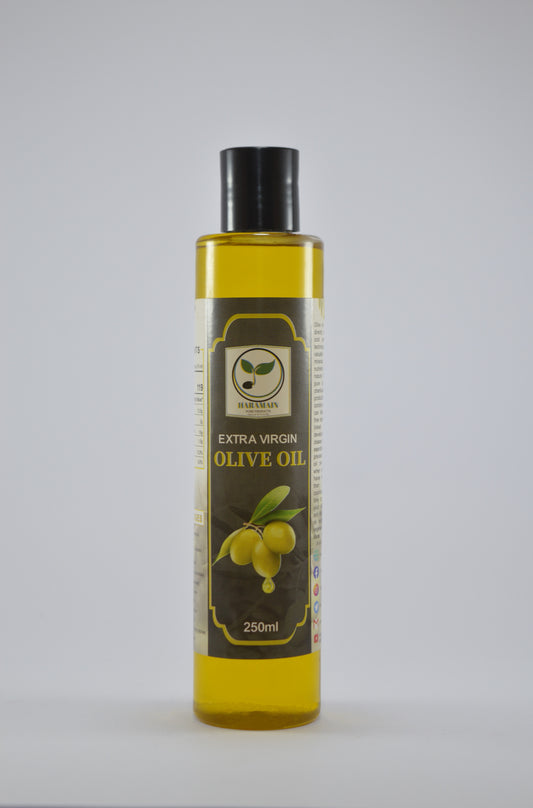 Bottle of extra virgin olive oil on a gray background