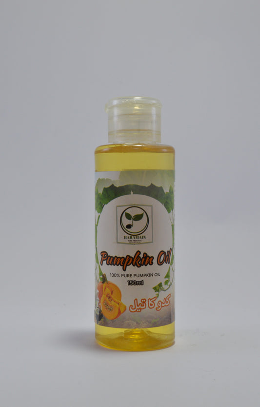 Bottle of pumpkin oil with a label on a gray background