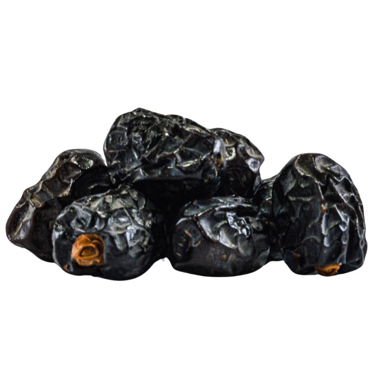 Group of dark berries on a white background