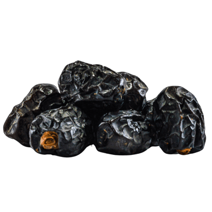 Group of dark berries on a white background