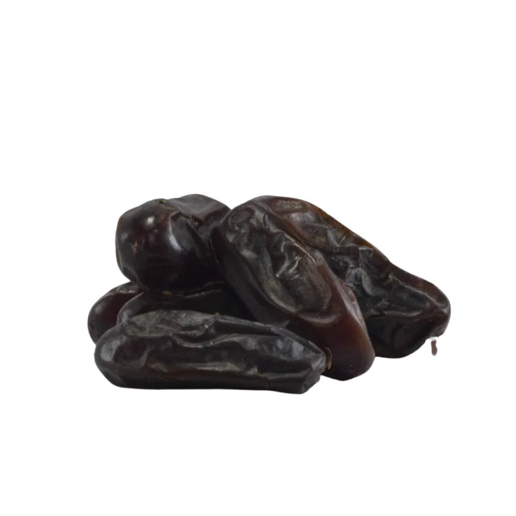 Three dried figs on a white background