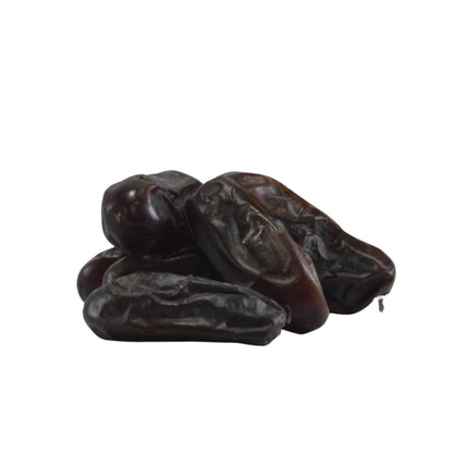 Three dried figs on a white background