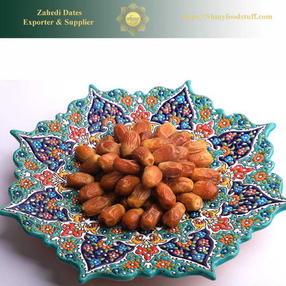 Decorative bowl with dates and 'Zahedi Dates Exporter & Supplier' branding.